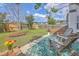 Relaxing backyard with Adirondack chairs, a privacy fence, and an inviting patio space at 255 Longford Dr, Summerville, SC 29483