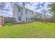 Large backyard with a privacy fence and well-maintained lawn that's perfect for outdoor activities at 255 Longford Dr, Summerville, SC 29483