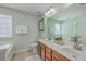 Light and bright primary bathroom with a double sink vanity and decorative mirror at 255 Longford Dr, Summerville, SC 29483