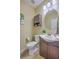 Cozy half bath with vanity, toilet, round mirror, and neutral wall color at 255 Longford Dr, Summerville, SC 29483