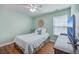Bright bedroom features a ceiling fan, hardwood floors, and plenty of natural light at 255 Longford Dr, Summerville, SC 29483
