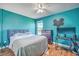 Stylish bedroom with blue accent wall, hardwood floors, and ample natural light at 255 Longford Dr, Summerville, SC 29483