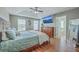 Beautifully decorated bedroom features a tray ceiling, hardwood floors, and a ceiling fan at 255 Longford Dr, Summerville, SC 29483