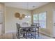 Cozy dining area with a modern table, six chairs, and decorative wall art at 255 Longford Dr, Summerville, SC 29483
