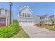 Charming two-story home with a well-manicured lawn and a two-car garage at 255 Longford Dr, Summerville, SC 29483