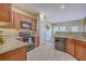 Modern kitchen with tile backsplash, wooden cabinets, and view of the open floor plan at 255 Longford Dr, Summerville, SC 29483