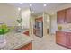 Bright kitchen featuring granite counters, stainless steel appliances and tiled floors at 255 Longford Dr, Summerville, SC 29483