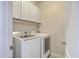 Laundry room with white washer and dryer, cabinets, and neutral wall color at 255 Longford Dr, Summerville, SC 29483