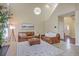 Bright living room featuring high ceilings, leather sofas, and a modern light fixture at 255 Longford Dr, Summerville, SC 29483