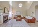 Inviting living room with a fireplace, leather sofas, and a large area rug at 255 Longford Dr, Summerville, SC 29483