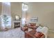 Cozy living room featuring a fireplace, comfortable sofas, and elegant window treatments at 255 Longford Dr, Summerville, SC 29483