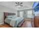 Large main bedroom with tray ceiling, ceiling fan and windows with blinds at 255 Longford Dr, Summerville, SC 29483