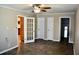 Bedroom features three doors, including a glass paned door at 259 E. Bay St # 1A, Charleston, SC 29401