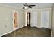 Spacious bedroom with tile floors and multiple doors at 259 E. Bay St # 1A, Charleston, SC 29401
