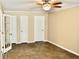 Bedroom showcases tile floor, ceiling fan, and multiple doorways at 259 E. Bay St # 1A, Charleston, SC 29401