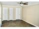 The empty bedroom features a ceiling fan and a tile floor at 259 E. Bay St # 1A, Charleston, SC 29401