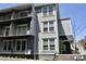 Exterior view of a multi-story home with a private balcony and an inviting entrance at 259 E. Bay St # 1A, Charleston, SC 29401