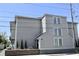 Angle exterior showing a multi-story home with an entrance and a brick fence at 259 E. Bay St # 1A, Charleston, SC 29401