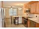 Kitchen with wooden cabinets, granite countertops, and stainless steel appliances at 259 E. Bay St # 1A, Charleston, SC 29401
