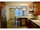 Kitchen with wooden cabinets, granite countertops, and stainless steel appliances at 259 E. Bay St # 1A, Charleston, SC 29401