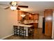 Kitchen with wooden cabinets, granite countertops, a breakfast bar, and stainless appliances at 259 E. Bay St # 1A, Charleston, SC 29401