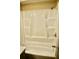 The pristine white shower features built-in shelves for organization at 259 E. Bay St # 1A, Charleston, SC 29401