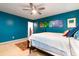 Bedroom featuring a ceiling fan, a bed, and blue walls at 29 Meander Row, Charleston, SC 29412