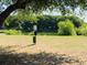 Expansive community grounds with a pond, waste disposal station, and ample green space for outdoor activities at 29 Meander Row, Charleston, SC 29412