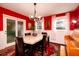 Bright dining room featuring a chandelier, large windows, and a beautiful rug at 29 Meander Row, Charleston, SC 29412
