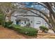 Charming two-story home with a blue door, manicured landscaping, and front-facing garage at 29 Meander Row, Charleston, SC 29412