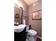 Cozy powder room featuring a toilet, sink, mirror, and stylish decorations at 29 Meander Row, Charleston, SC 29412