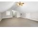 Finished attic space with a ceiling fan, neutral carpet, and white trim at 298 Hook Ln, Mount Pleasant, SC 29464
