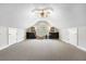 Finished attic space with a ceiling fan, window, and built-in bookshelves at 298 Hook Ln, Mount Pleasant, SC 29464