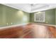 Spacious bedroom with tray ceiling, ceiling fan and hardwood floors at 298 Hook Ln, Mount Pleasant, SC 29464
