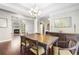 Dining room with hardwood floors, view to the living room, chandelier, and decorative moldings at 298 Hook Ln, Mount Pleasant, SC 29464