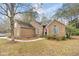 Charming single Gathering home with classic brick exterior, mature trees, meticulous landscaping and sidewalks at 298 Hook Ln, Mount Pleasant, SC 29464