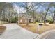 Brick home with mature trees and a long driveway at 298 Hook Ln, Mount Pleasant, SC 29464