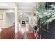 An inviting view of the foyer leading to the bright and airy living room with grand windows and a fireplace at 298 Hook Ln, Mount Pleasant, SC 29464