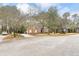 Charming single-story brick home with a well-manicured lawn and driveway at 298 Hook Ln, Mount Pleasant, SC 29464