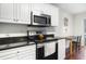 Well-lit kitchen features stainless steel appliances and granite countertops at 298 Hook Ln, Mount Pleasant, SC 29464