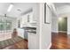 Bright kitchen featuring stainless steel appliances, white cabinets, and hardwood floors at 298 Hook Ln, Mount Pleasant, SC 29464