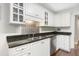 Kitchen featuring granite counters, stainless appliances, white cabinets and stainless backsplash at 298 Hook Ln, Mount Pleasant, SC 29464