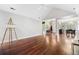 Spacious living room with hardwood floors, high ceilings, view to dining room and foyer, and lots of natural light at 298 Hook Ln, Mount Pleasant, SC 29464