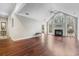 Spacious living room boasts hardwood floors, high ceilings, lots of natural light, and a cozy fireplace at 298 Hook Ln, Mount Pleasant, SC 29464
