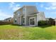 Well-maintained backyard with green grass and a patio, perfect for outdoor entertaining at 306 Todder Trl, Goose Creek, SC 29445