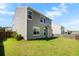 Well-maintained backyard with green grass and mature trees providing ample privacy at 306 Todder Trl, Goose Creek, SC 29445