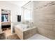 Modern bathroom featuring walk-in shower and separate soaking tub with tiled surround at 306 Todder Trl, Goose Creek, SC 29445