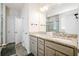 Bright bathroom featuring a granite countertop, gray cabinets, and a glass-enclosed shower at 306 Todder Trl, Goose Creek, SC 29445
