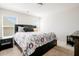Well-lit bedroom with a comfortable bed, neutral carpet, and bright, inviting windows at 306 Todder Trl, Goose Creek, SC 29445