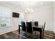 Formal dining room featuring hardwood floors and a contemporary chandelier at 306 Todder Trl, Goose Creek, SC 29445